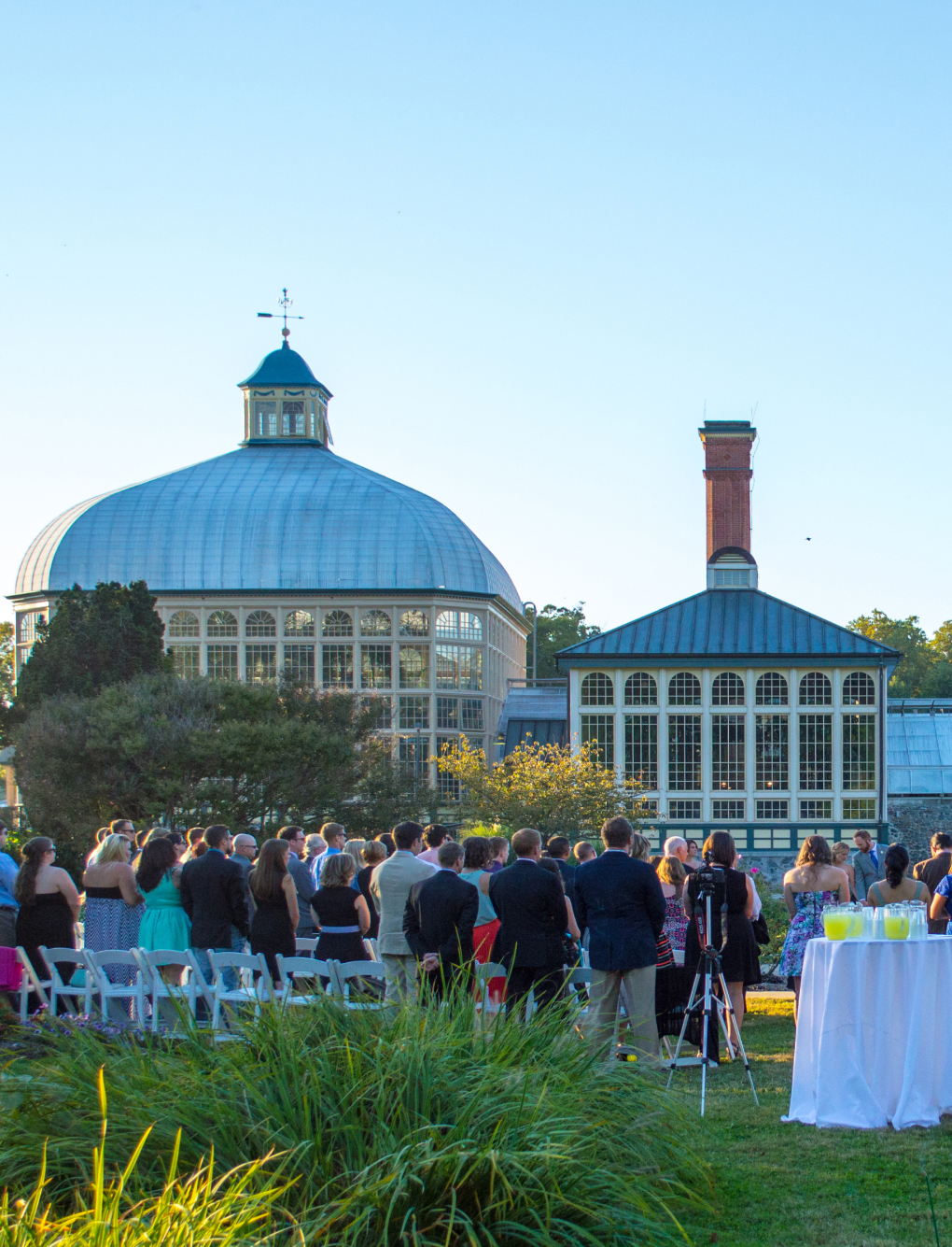 An outdoor wedding reception in the Outdoor Gardens on a clear afternoon